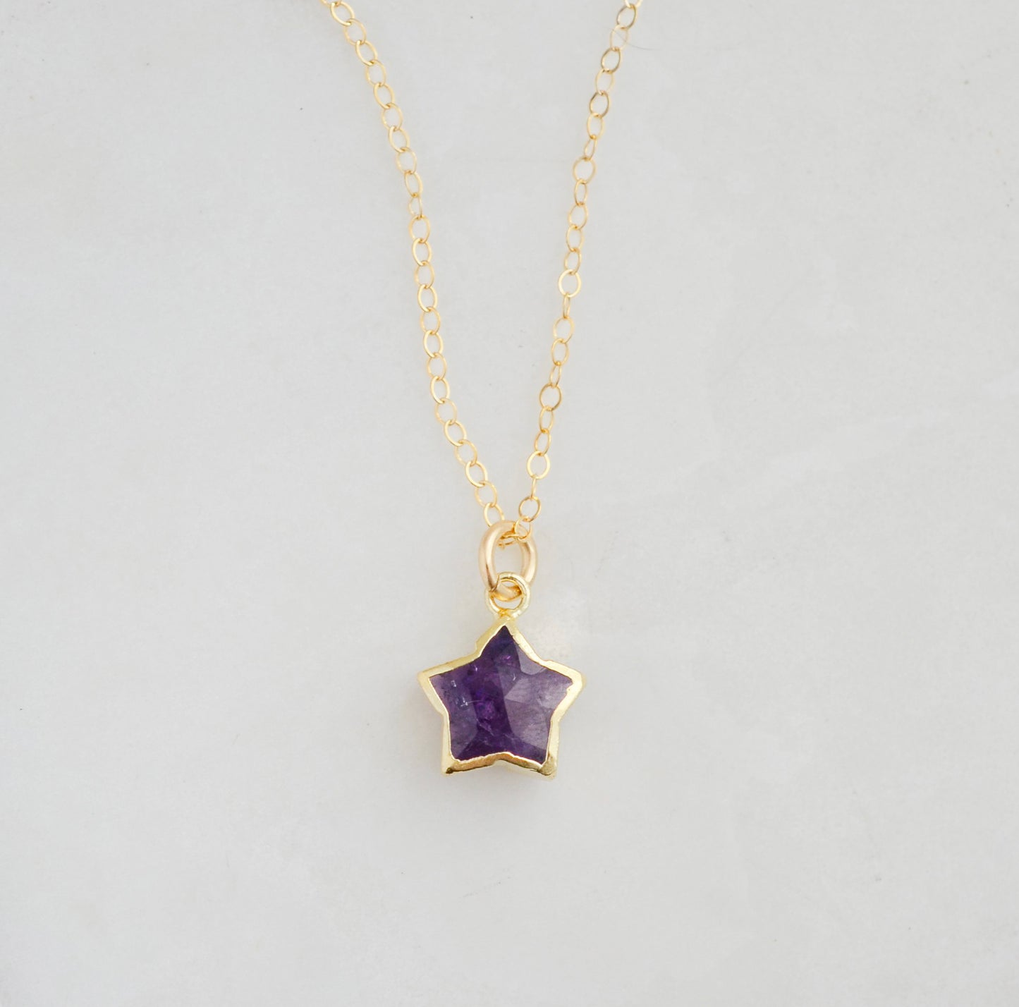 Handmade genuine purple amethyst star pendant set on a 14k gold filled chain. This necklace is also available in sterling silver.