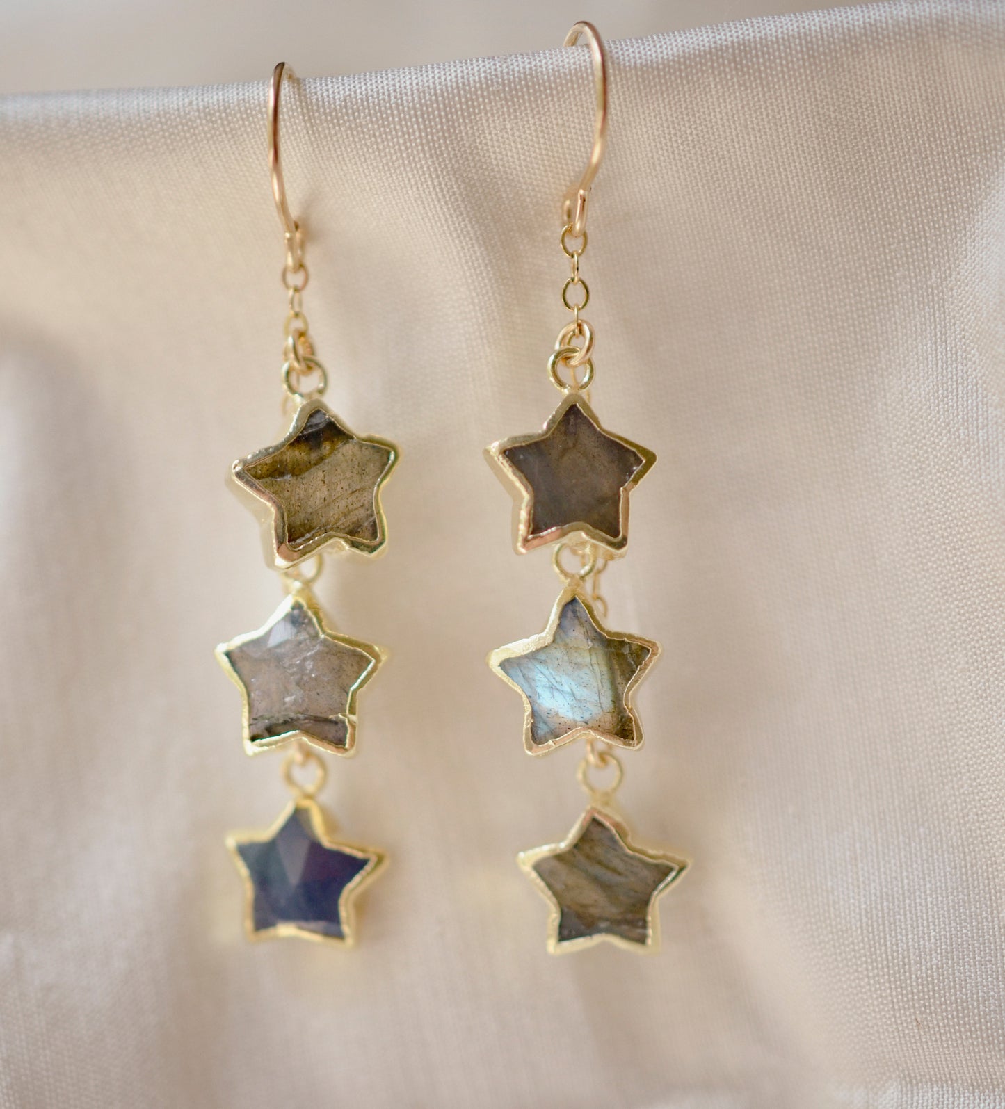 Three labradorite star shaped gemstones hang from each earring. Shown in gold filled.