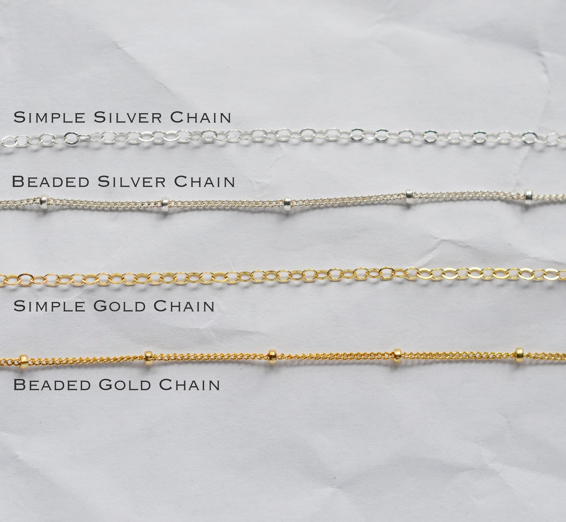 Chain options for the necklace. A simple chain is a cable chain. The beaded chain has small beads dotting the chain.