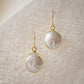 Natural white freshwater pearl dangle earring. The pearl is set in 22k gold electroplate and suspended from 14k gold filled earwires. 