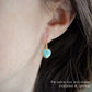 Natural rainbow moonstone stone heart earrings in gold. The stones are white, but flash blue with movement.
