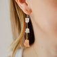 Raw crystal and sunstone earrings. Three rough crystals set on a sterling silver or gold filled chain. Modeled image.