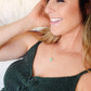 Genuine aqua blue Amazonite gemstone cut into a faceted cube and suspended on a gold filled cable chain. Modeled Image.
