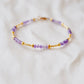 Handmade beaded gemstone crystal bracelet in gold filled or sterling silver. These bracelets feature a gemstone of your choice on a bracelet that can be stacked with others or worn alone.  Shown in purple amethyst.