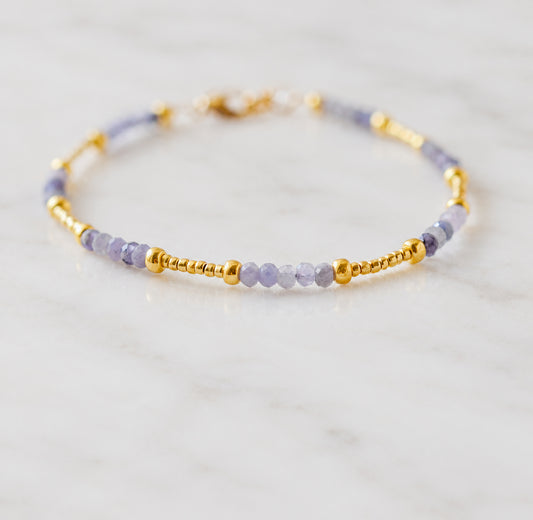 Handmade beaded gemstone natural Tanzanite crystal bracelet in gold filled or sterling silver. These bracelets feature a gemstone of your choice on a bracelet that can be stacked with others or worn alone. Handmade jewelry by Gemnia in Connecticut