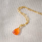 A natural orange to orange-red faceted Carnelian teardrop set on a 14k gold filled chain. The stone is real and a triangular teardrop shape. Handmade in Connecticut by Gemnia, this necklace is also available in sterling silver. 