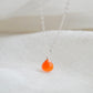 A real, real orange Carnelian stone teardrop pendant suspended from a sterling silver cable chain. This necklace is handmade and also comes in 14k gold filled. The crystal is faceted and varies in shades of orange to red.