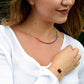 Modeled rainbow chakra pride necklace in sterling silver.