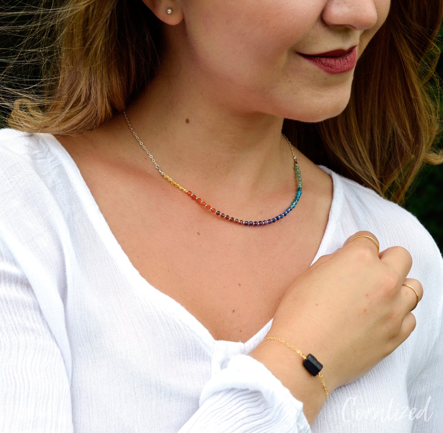 Modeled rainbow chakra pride necklace in sterling silver.