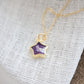 Handmade genuine purple amethyst star pendant set on a 14k gold filled chain. The stone is shown on its side. The bezel is only on the edges of the stone.