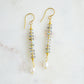Handmade beaded dangle earrings with labradorite and white freshwater pearls. These artisan earrings are a long bar style with dainty pearls on the bottom. The gemstones flash blue and green.