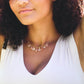 Orange, peach Sunstone and clear Crystal Quartz teardrops dangle off a 14k gold filled chain. Modeled image. 
