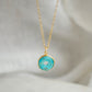 This necklace is handmade with a turquoise stone cut in a doughnut shape then suspended from a 14k gold filled chain. Also available in sterling silver. 