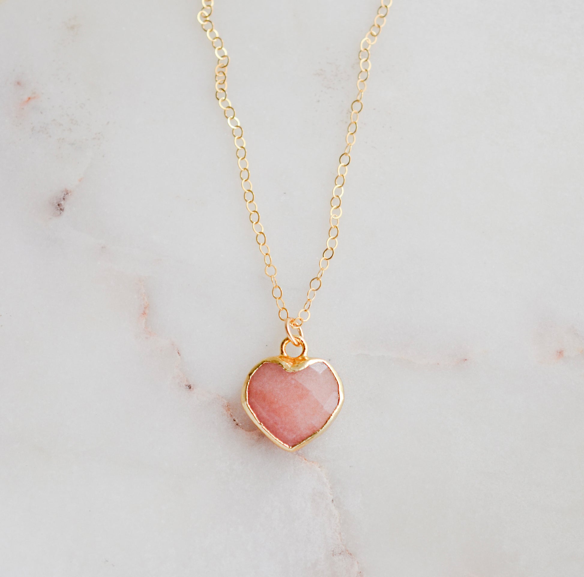 Handmade necklace with a natural pink opal heart-shaped pendant on a 14k gold filled chain. Handcrafted dainty gemstone jewelry by Gemnia.