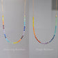 A beaded rainbow, chakra, or pride necklace handmade with natural crystal gemstones in sterling silver or 14k gold filled. All jewelry is handmade in Connecticut by Gemnia Jewelry.