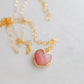 Handmade necklace with a natural pink opal heart-shaped pendant on a 14k gold filled chain. Handcrafted dainty gemstone jewelry by Gemnia.