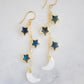 These handmade earrings feature genuine labradorite stars atop rainbow moonstone crescent moons. These dangles are long but lightweight. Shown in gold, but also available in sterling silver.