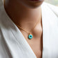 This necklace is handmade with a turquoise stone cut in a doughnut shape then suspended from a 14k gold filled chain. Also available in sterling silver. 