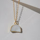 This necklace is handmade with a natural white druzy quartz pendant in a half-circle or crescent shape. Available in 14k gold filled.