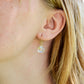 Mystic Topaz earrings modeled in 14k gold filled. The gemstone is a faceted heart briolette teardrop shape.